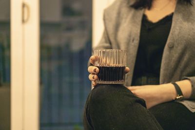 Close-up of woman holding drink