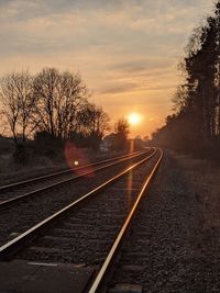 View of railroad tracks at sunset
