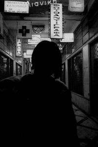 Rear view of man walking at airport