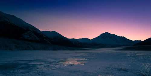 Scenic view of mountains against sky during sunset