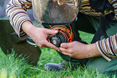 Midsection of man working in field