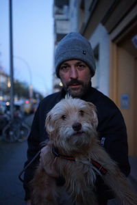 Portrait of man with dog