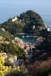 High angle view of townscape by sea