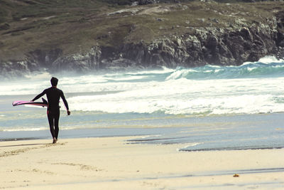 Man surfing on beach