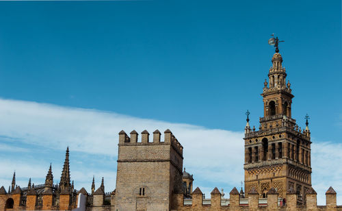 Low angle view of historical building against blue sky