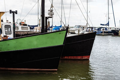 Boats moored at harbor