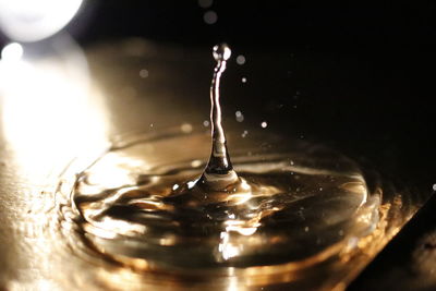 Close-up of drop splashing in water