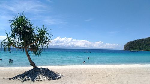 Scenic view of sea against blue sky during sunny day