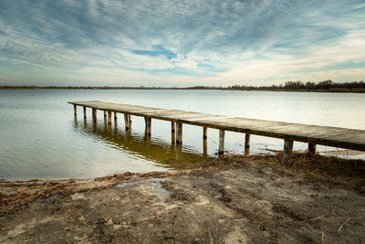 A long wooden bridge in the water