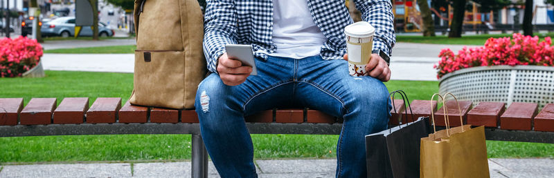 Man sitting on bench in park