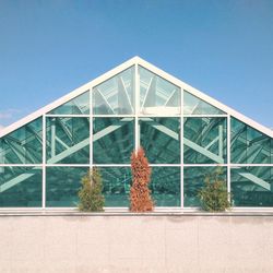 Low angle view of building against clear blue sky