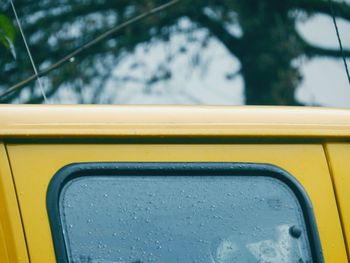 Close-up of raindrops on van window