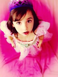 Close-up portrait of girl with pink flower