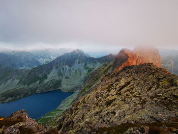 Cloudy mountain peaks at sunrise. tatry poland, rysy on the right.
