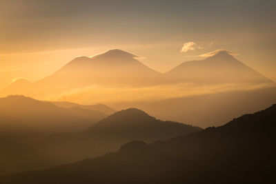 Scenic view of mountains against sky during sunset