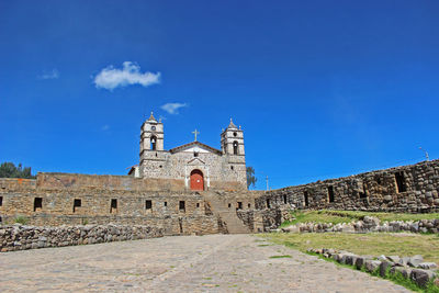 Low angle view of san juan bautista church in vilcashuaman, above inca's stone structures, ayacucho