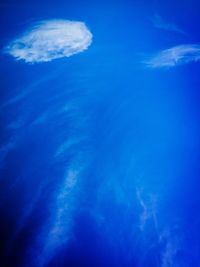 Low angle view of sea against blue sky