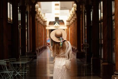 Rear view of woman standing in church