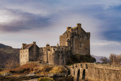 Low angle view of old building against sky
