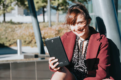 Young woman using mobile phone