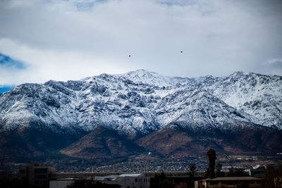 Scenic view of snowcapped mountains against sky