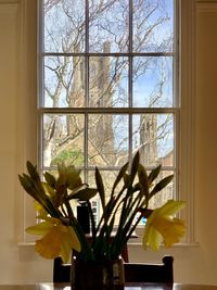 Close-up of flower vase on window sill