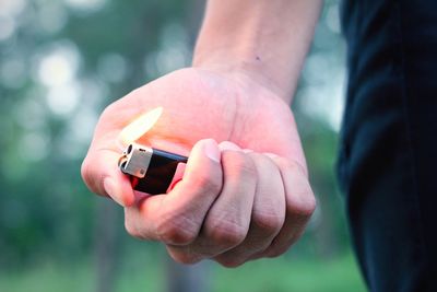 Close-up of man holding hands
