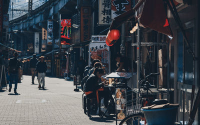 People walking on street in city