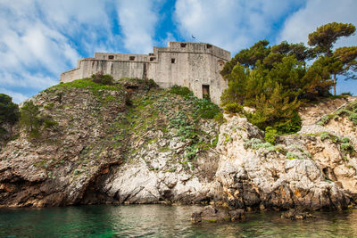 Dubrovnik west pier and the medieval fort lovrijenac located on the western wall of the city