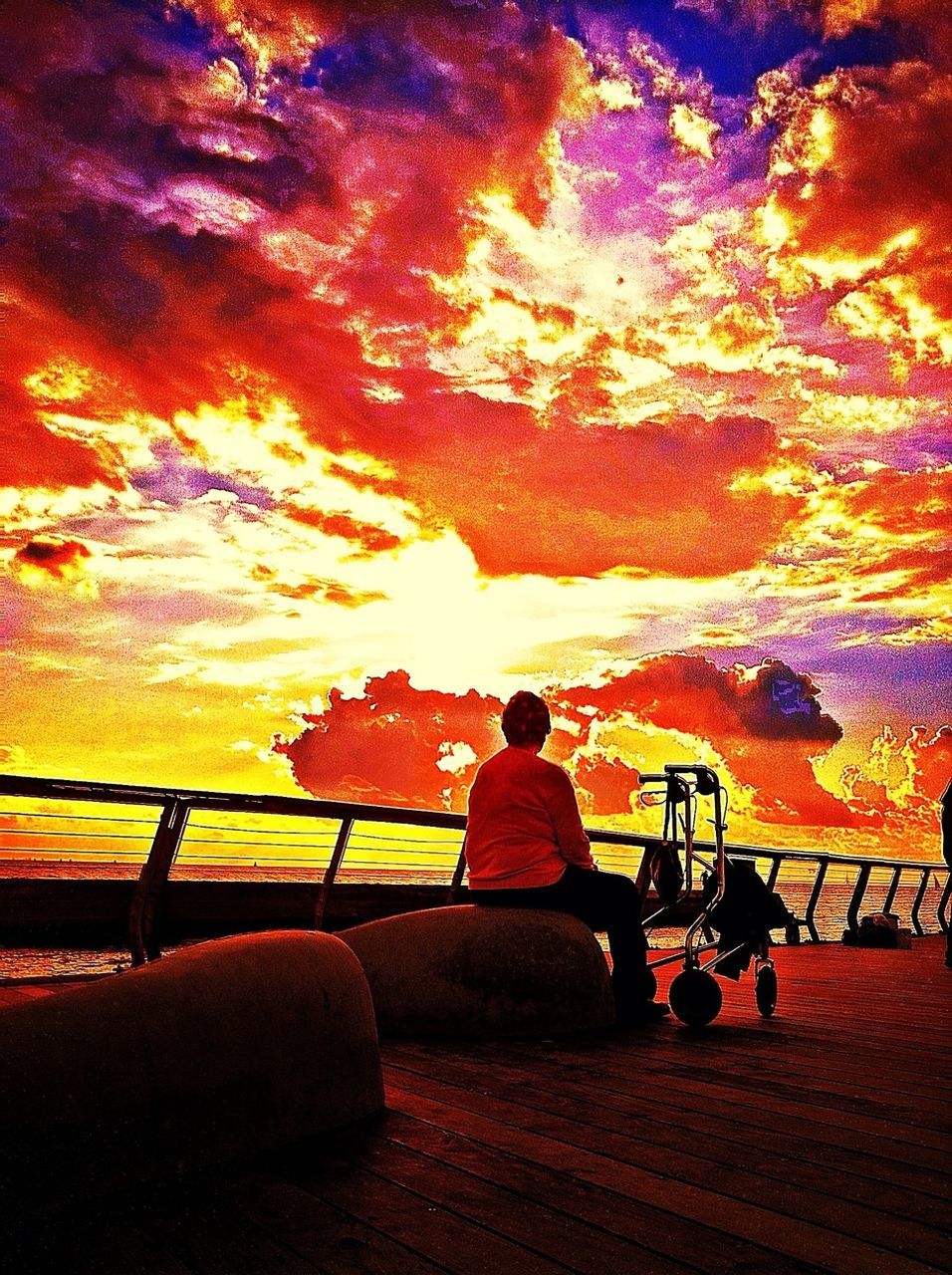 sunset, orange color, sky, cloud - sky, silhouette, tranquility, dramatic sky, beauty in nature, bench, scenics, nature, dusk, outdoors, railing, red, cloud, tranquil scene, leisure activity