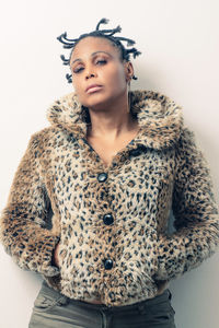 Portrait of woman standing in snow