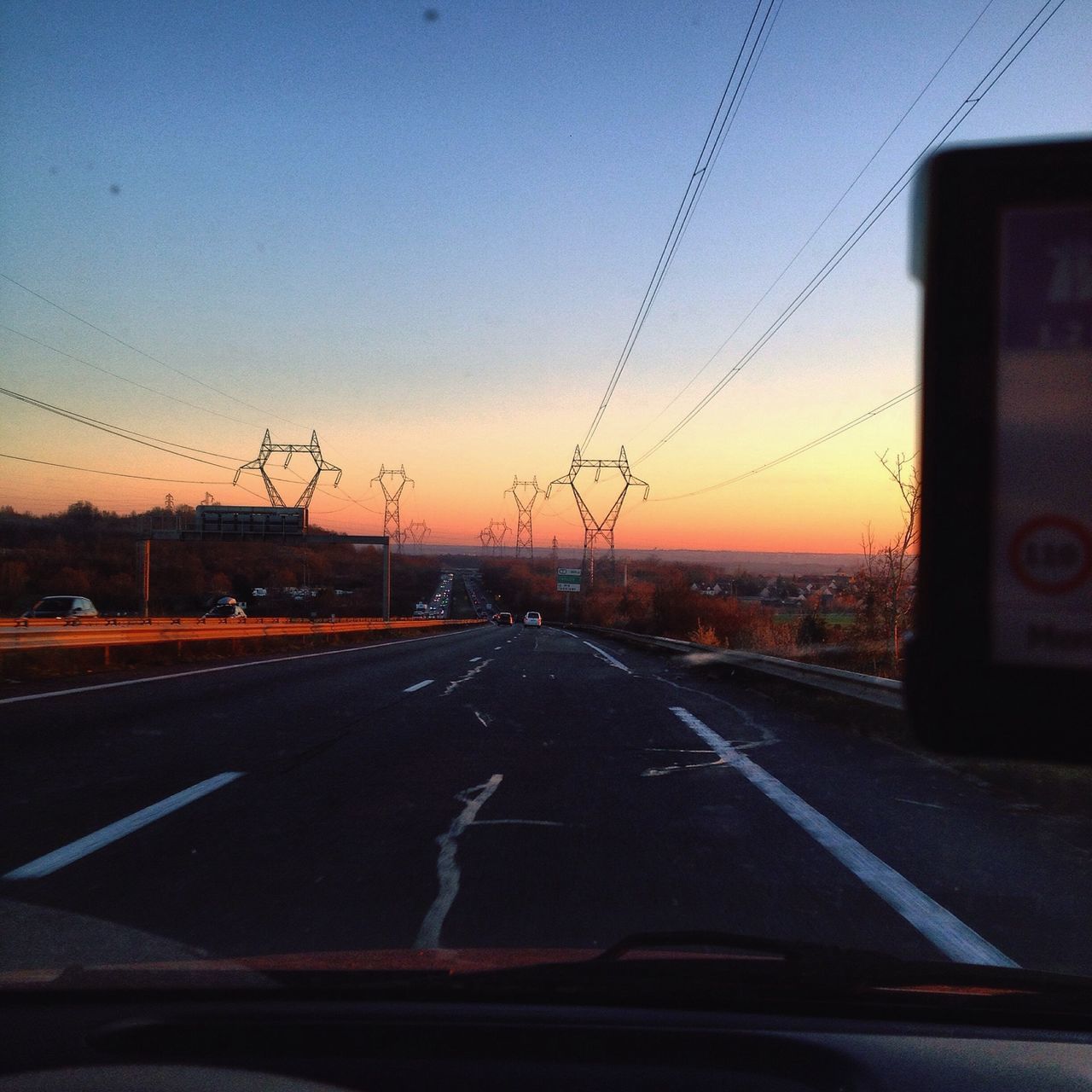 transportation, road, sunset, the way forward, road marking, car, mode of transport, sky, land vehicle, diminishing perspective, street, electricity pylon, clear sky, power line, vanishing point, travel, blue, no people, outdoors, dusk