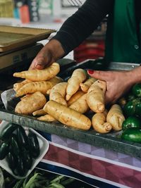 Midsection of man preparing food