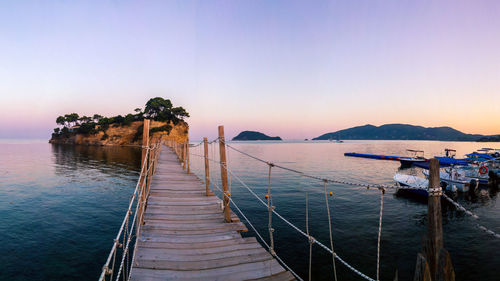 Scenic view of sea against clear sky during sunset