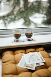 Coffee cup on window sill 