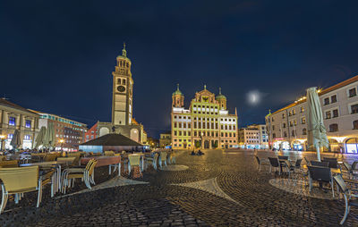 Illuminated buildings in city at night