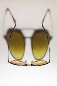 Close-up of sunglasses against white background