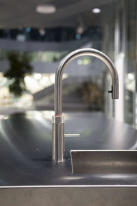 Close-up of faucet in bathroom