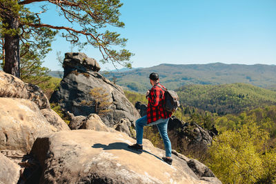 Rear view of man walking on mountain