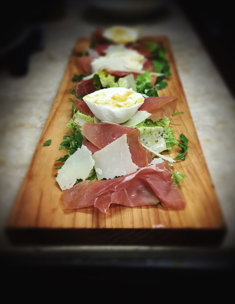 CLOSE-UP OF SALAD ON TABLE