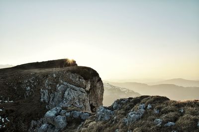 Rock formations on landscape against clear sky