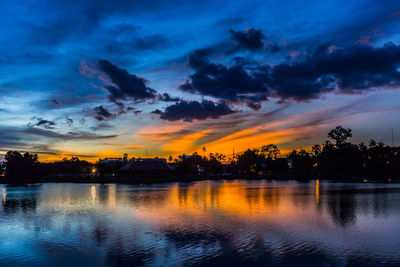 Scenic view of lake against orange sky