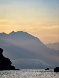 Scenic view of mountains against sky during sunset