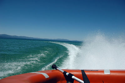 Boat moving on sea against sky