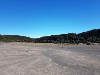 Scenic view of landscape against clear blue sky