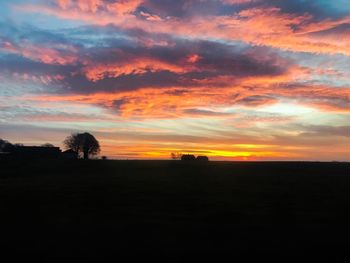 Scenic view of silhouette landscape against sky during sunset