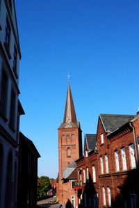 Low angle view of buildings against clear sky