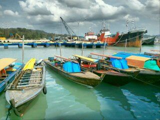 Boats moored at harbor