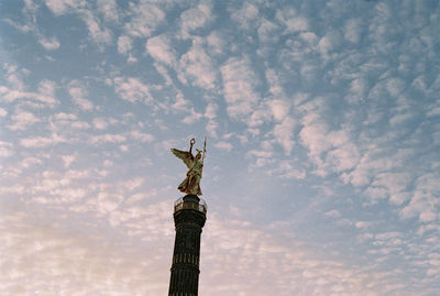 Low angle view of statue against sky