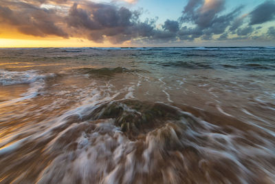 Scenic view of sea against sky during sunset